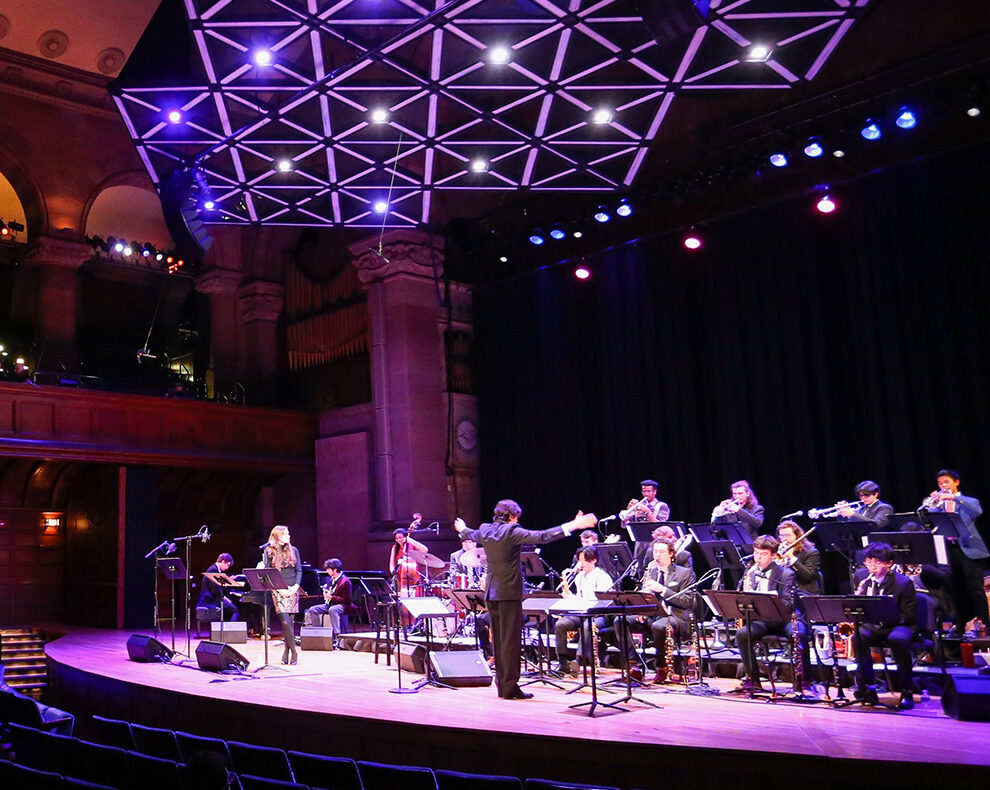 Jazz's Large Ensemble playing on stage during a live performance
