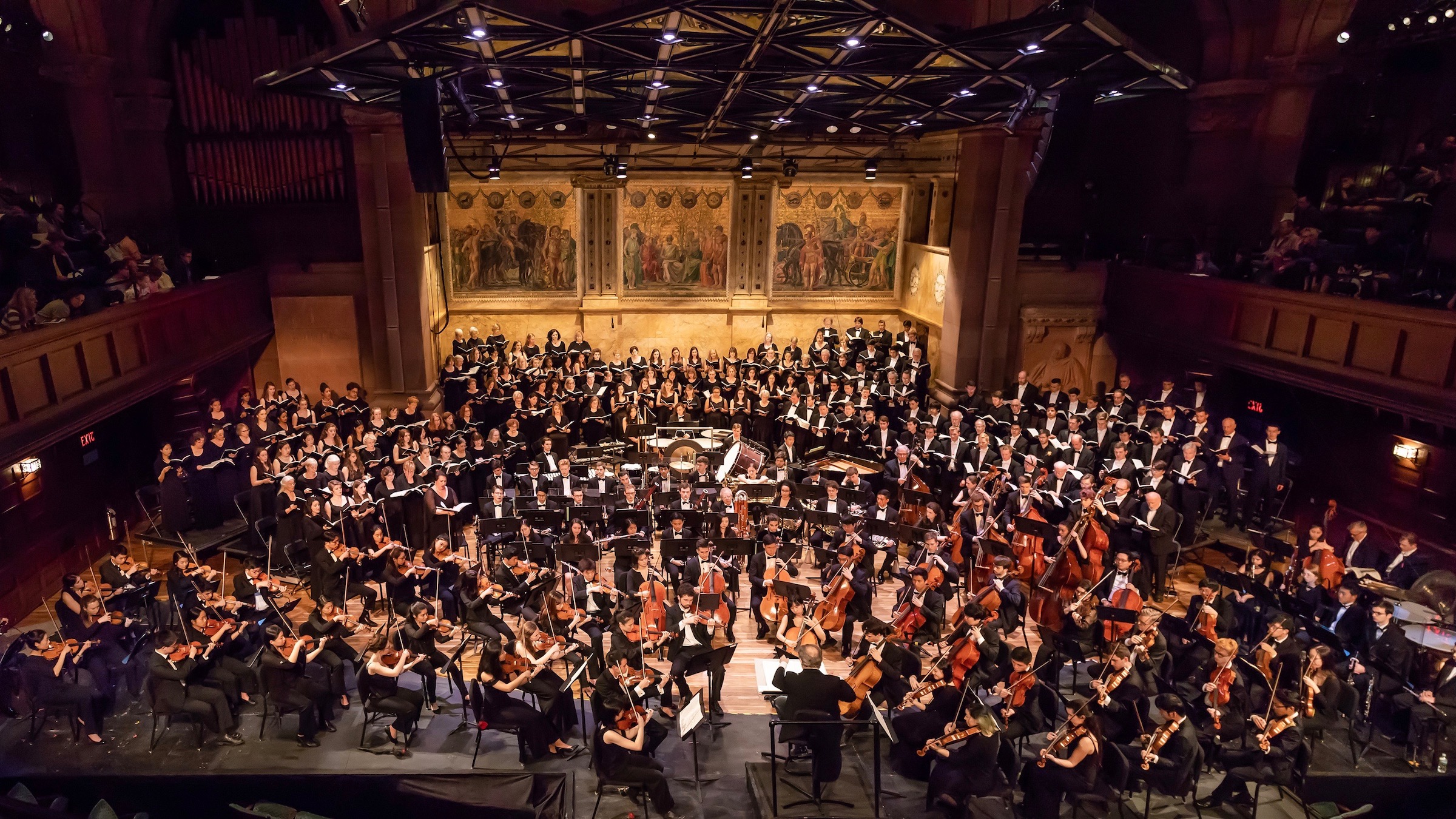 photo of Princeton University Orchestra and Glee performing on stage together.