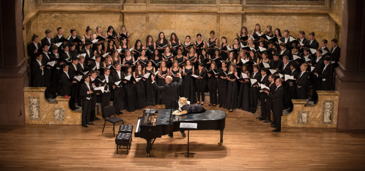 Photo of Yale and Princeton Glee Clubs singing on stage
