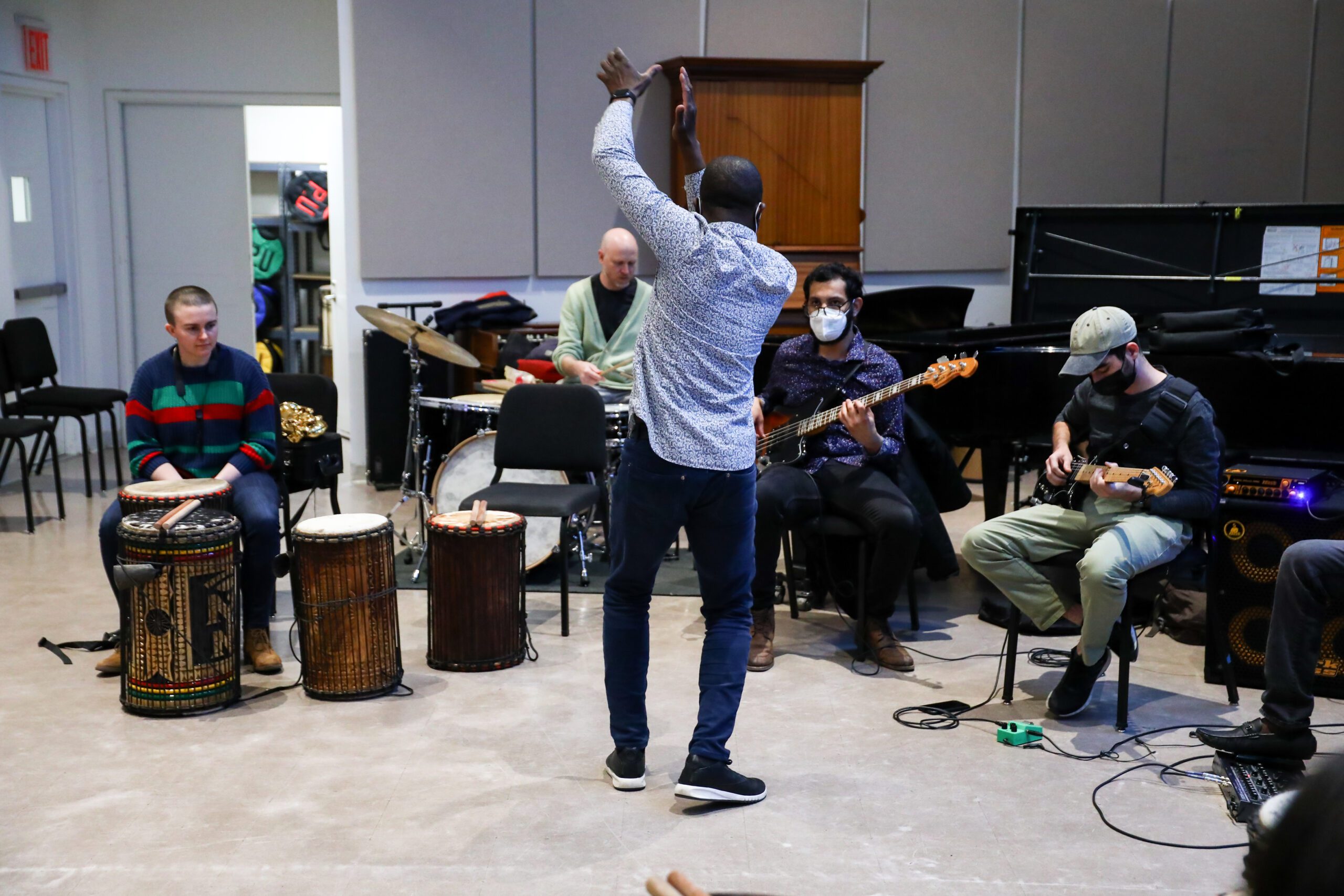 Photo of African Music class rehearsal, with students playing different African drums.