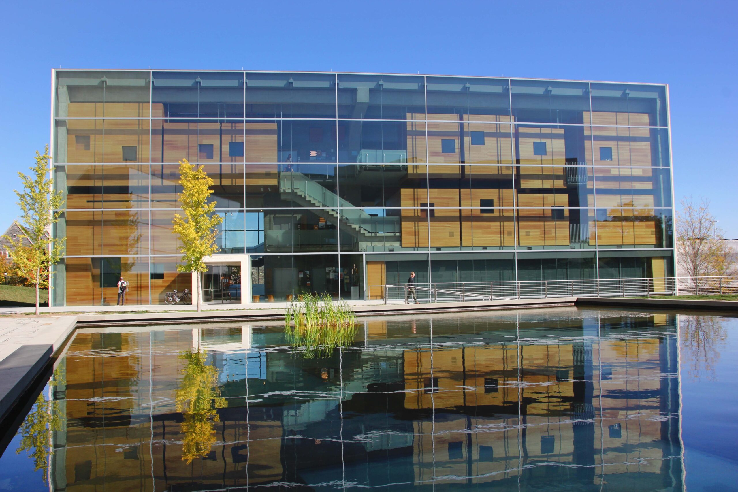 Effron Music Building reflected in the Lewis Center Arts complex pool